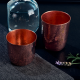 par de vasos de cobre